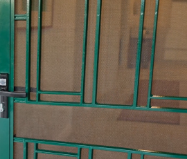Green security screen door with Heritage style Prowler Proof decorative grille and lock